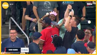 Birthday girl shows off her arm after catching home run at Braves game