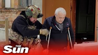 Volunteers evacuate Ukrainian injured man from frontline town in Donbas