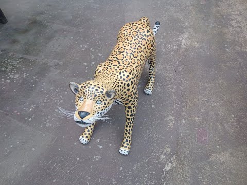 Beautiful cement jaguar using paint cans