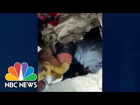 Rescuers save baby trapped under collapsed building in Turkey.