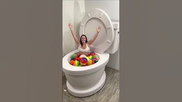 Going UNDER in Worlds Largest Toilet with Sports Balls #shorts