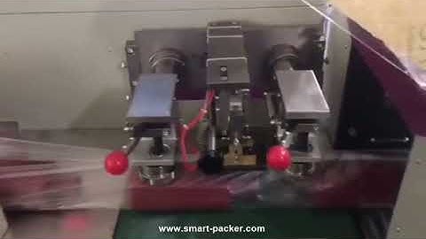 Empty cosmetic bottle flow type automatic bag film wrapping sealing packing machine