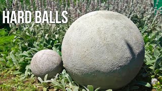 Decorative balls of cement and sand. Garden crafts