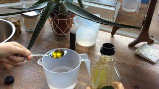 Measuring 300ml water and 3 tablespoons oil for bread recipe