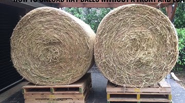 Unloading Round hay bales without front and loader.