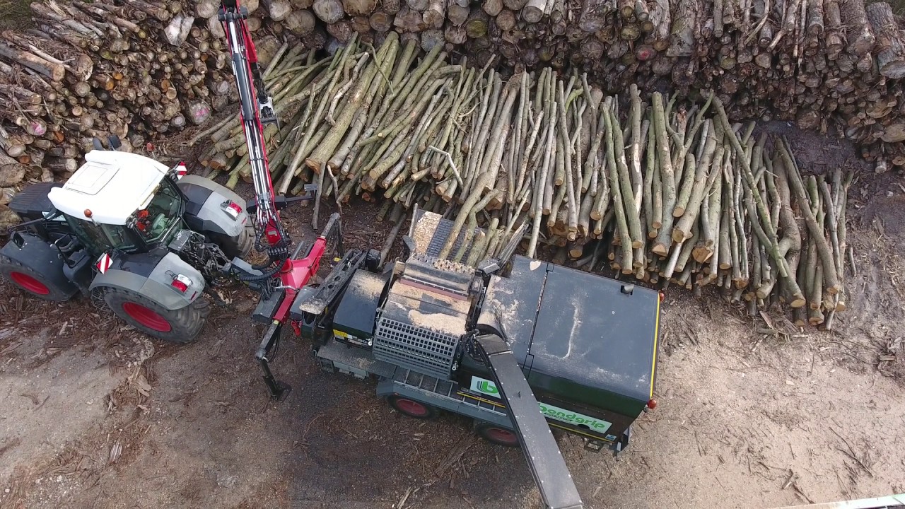Wood chipping for biomass boilers - YouTube