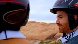Couple In Helmets In Desert Off Roading Close Up
