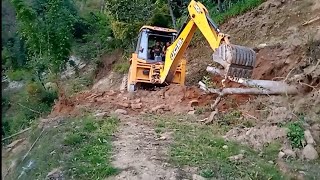 JCB Backhoe Loader Working landslide place width hilly base road hilly area screenshot 2