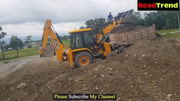 JCB Backhoe machine loading Gravel in Tipper.
