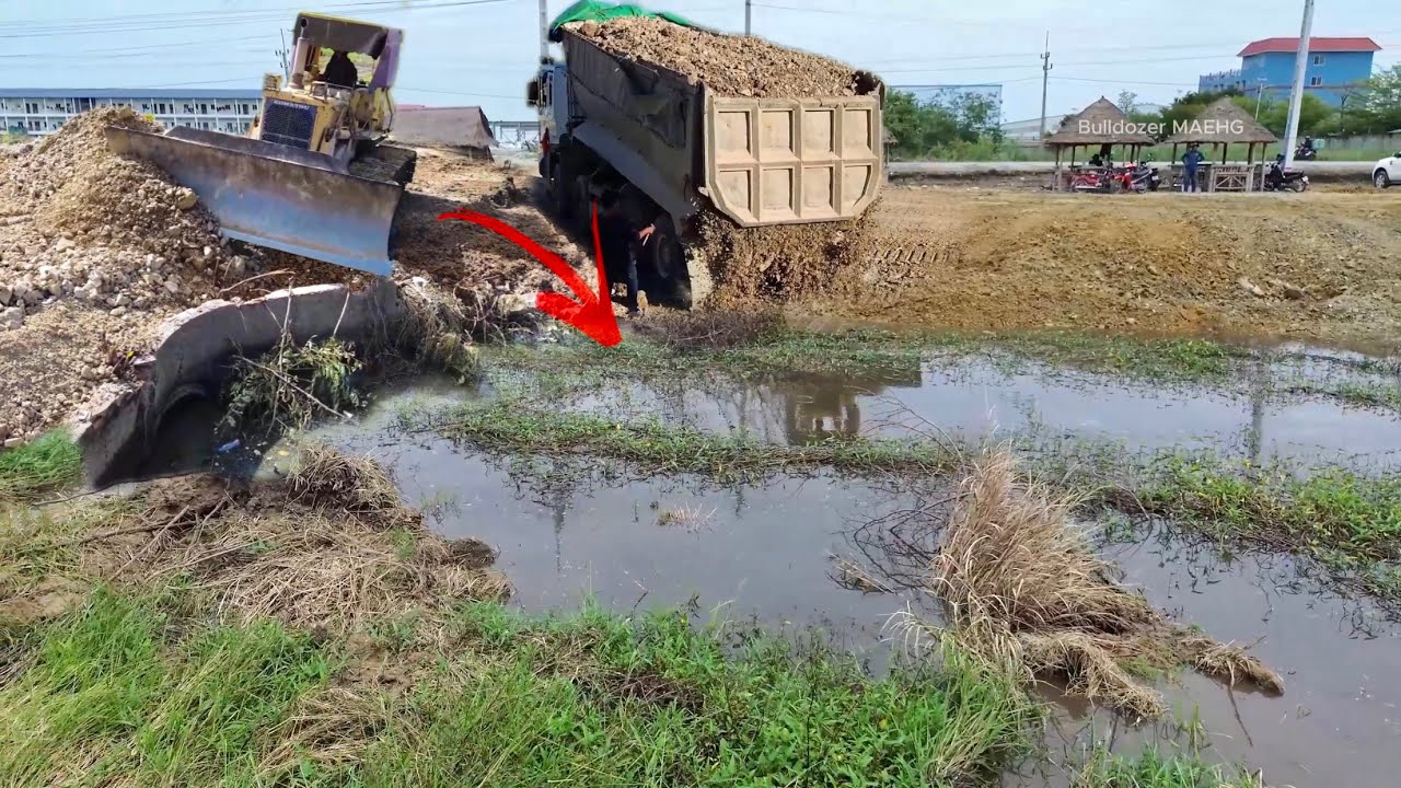Loading Rock Process Filing a Pond using KOMATSU D53P Bulldozer & 25,5 Ton Dump Trucks!
