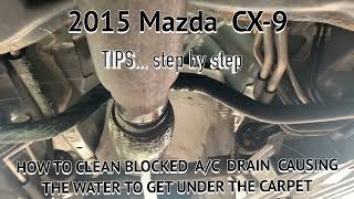 MAZDA 2015 HOW TO CLEAN THE A/C DRAIN CAUSING THE WATER TO GET UNDER THE CARPET