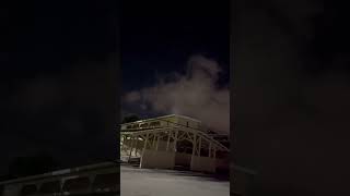 Unidentified Flashing Lights Over Night Clouds