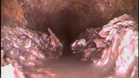 Soft blockage, scale build up inside 4" cast iron drain