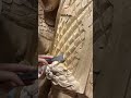 carving on wood in making a statue is done by a wood craftsman#youtubeshorts