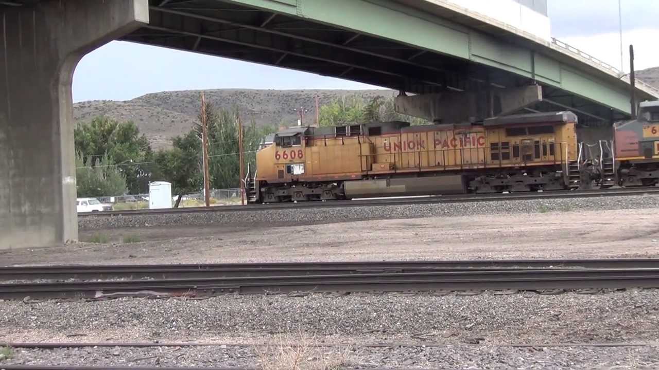 Union Pacific RR 6608 mixed freight with SP patch jobs crawls to a