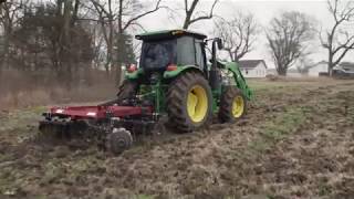 John Deere Discing up New Ground