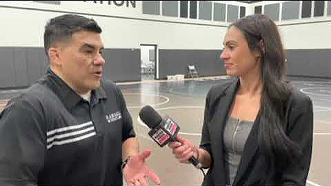 Stephanie Bates talks with Randall wrestling coach...