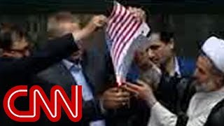 Iranian lawmakers burn American flag after US leaves deal