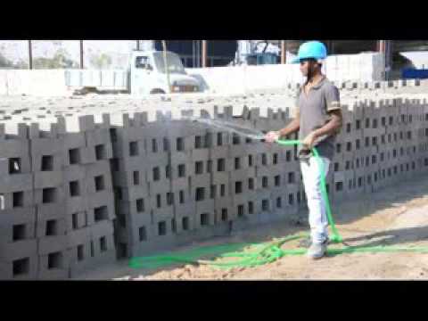 finished block curing in natural of concrete block making machine - YouTube