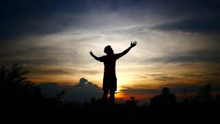 Silhouettes of relax man with the background of the sunset sky    Free HD Video Clips & Stock Video
