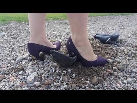 Purple heels against black ankle boots