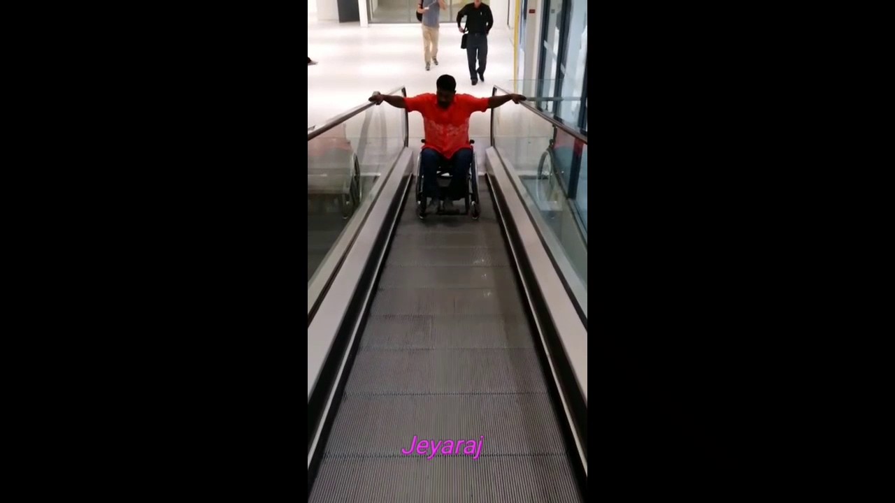 Wheelchair getting up Escalator YouTube