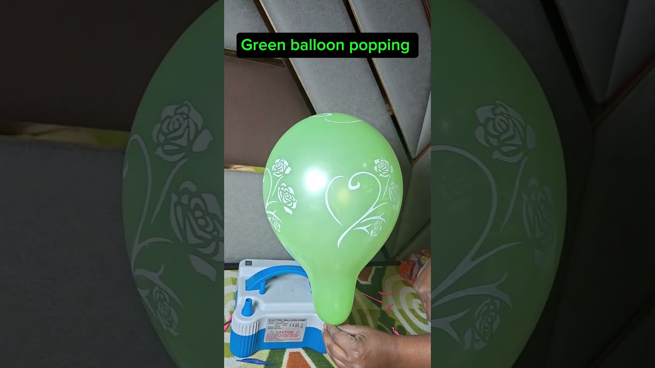 Green colour balloon popping 