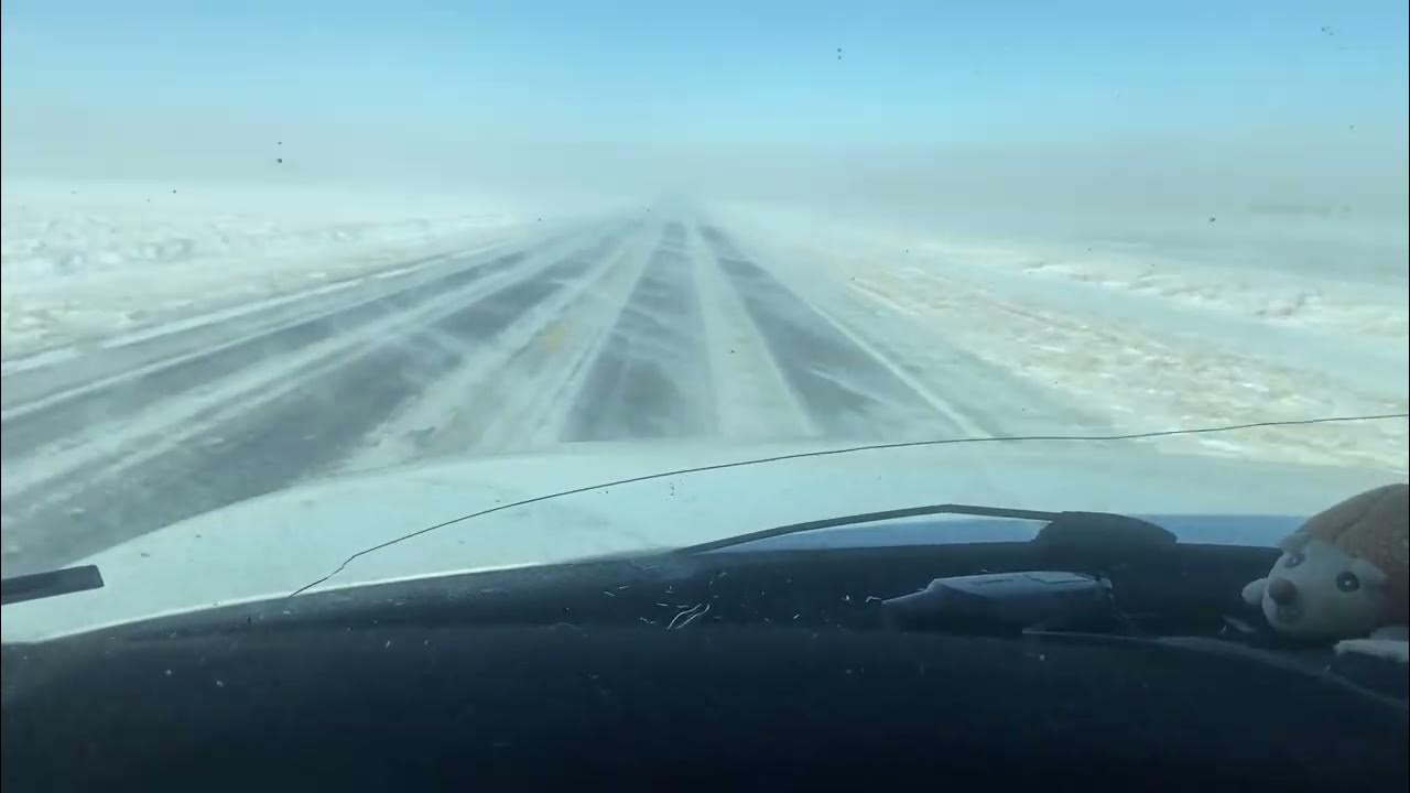 Glare ice from snow dust across road, 60mph gusts. YouTube