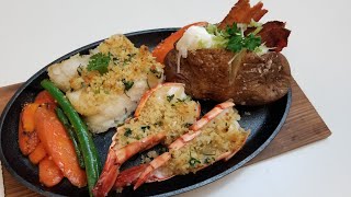 Seafood Platter Baked Bacon Potatoes, Garlic Parsley Butter Coating on Fillet Cod Fish \& Tiger Prawn