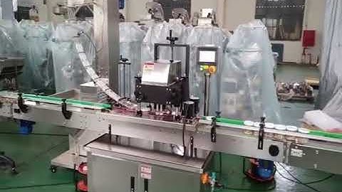 Automatic bottle cap positioning screw capping machine testing video