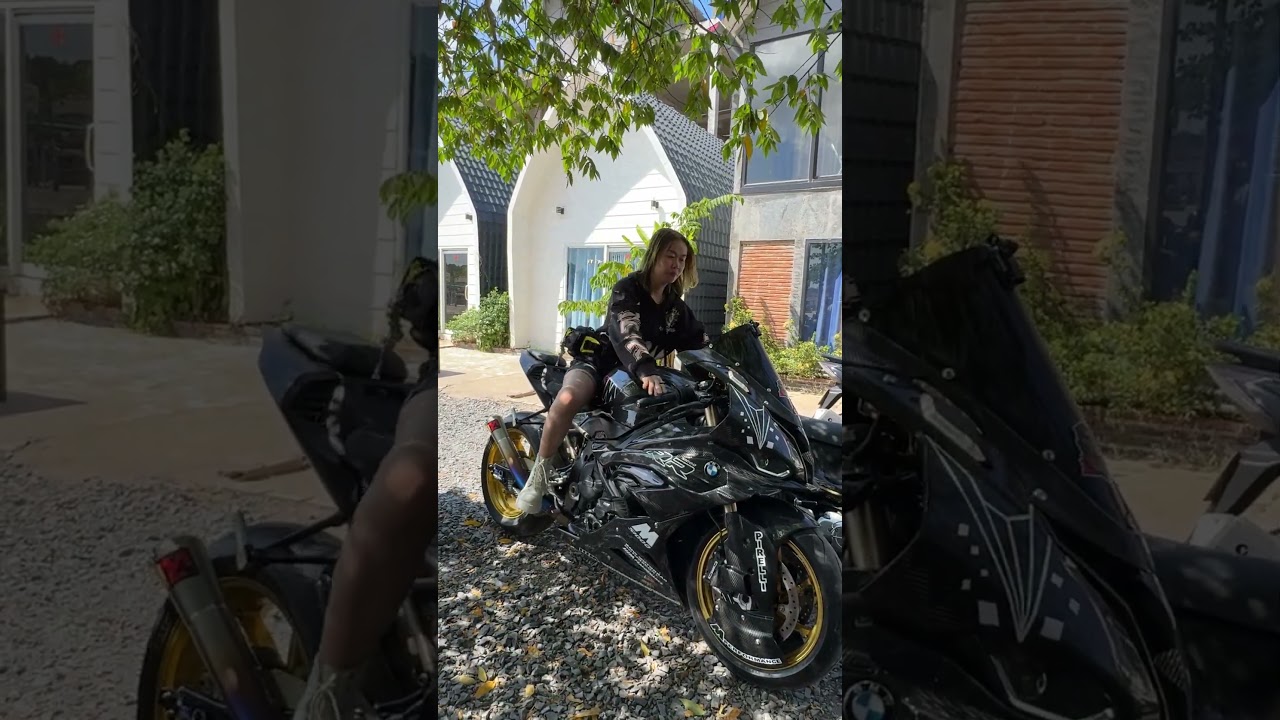 Beautiful woman riding a big BMW motorcycle