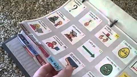 Finn using a PODD communication book