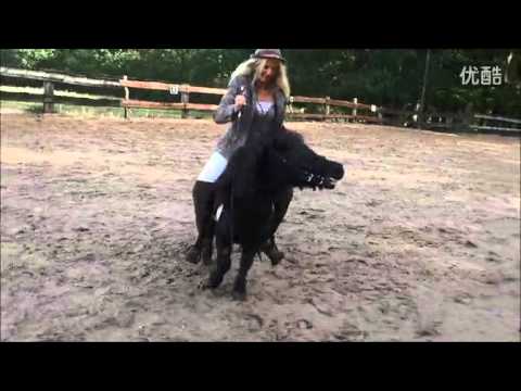 Woman rides tiny pony