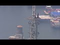 People climb to top of Empire State Building spire; raise flag in New York City