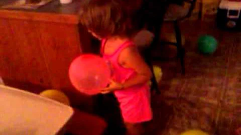 My autistic daughter playing with balloons