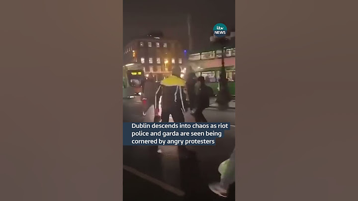 Dublin descends into chaos as riot police and garda are seen being cornered by angry protesters