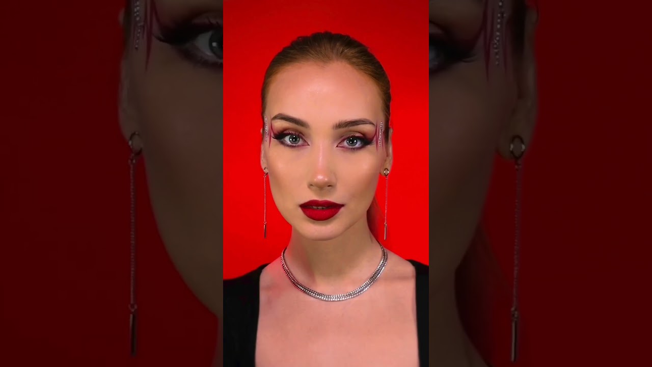 Red Heartbeat eyeliner with rhinestones makeup look 