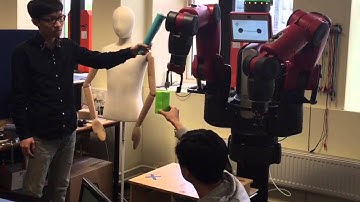 Visual Servoing Control of Baxter Robot Arms with Obstacle Avoidance using Kinematic Redundancy