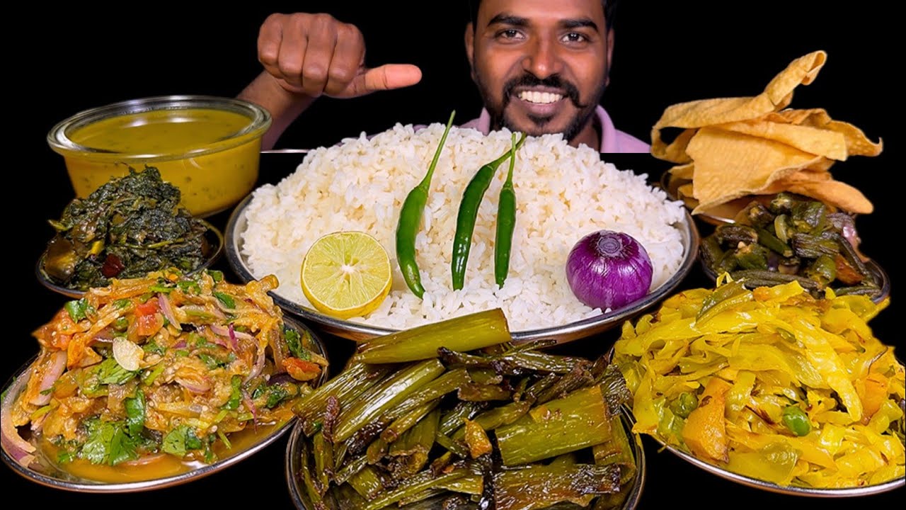 Eating Baingan Bharta Dal Chawal Saag Bhaja Spring Onion Fry Bhindi Aloo Bhaji & Cabbage Matar Bhaja