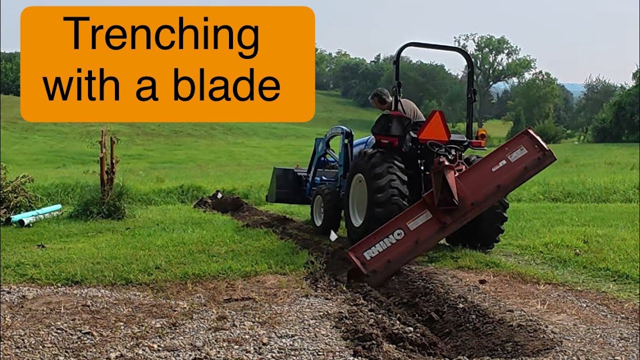 Trenching with my scraper blade and tractor to replace a gutter downspout pipe cch0042