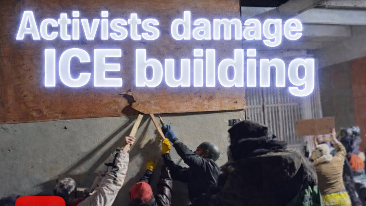 Activists try to damage the ICE building in Portland, Oregon