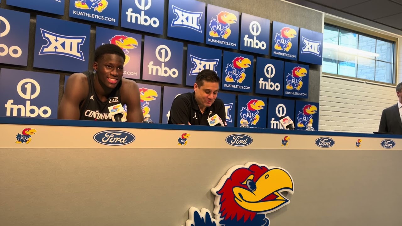 Cincinnati’s Wes Miller and Moustapha Thiam after beating KU