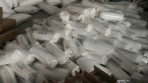 Pillow compress and roll packing machine