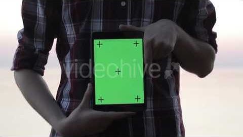 Man Holding a Tablet With a Green Screen - Stock Footage | VideoHive 13092795