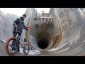 RIDING BMX INSIDE OF A MASSIVE FULL PIPE 50FT UNDERGROUND!