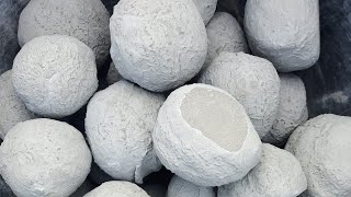 Dusty pure cement balls crumbling in water and yummy paste play