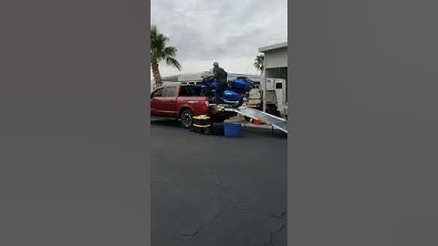 loading motorcycle into pick up truck
