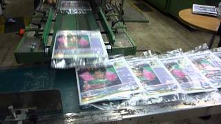 CAM - Wrapping System for Newspaper Flyer Inserts