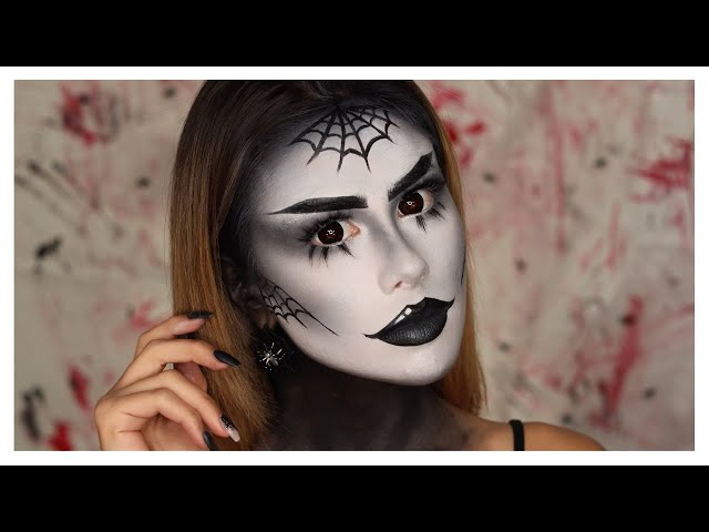 Close up of greyscale Halloween makeup done using MAC white full coverage  foundation. Black a…