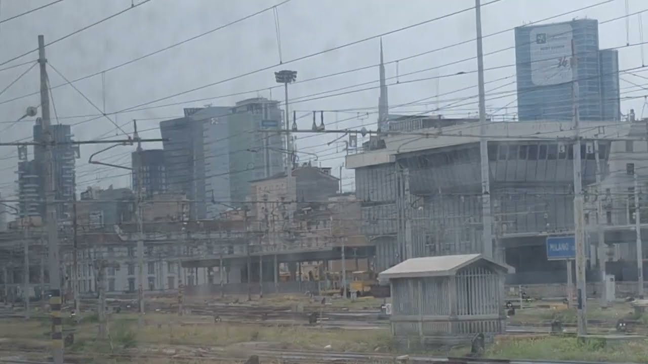 Milan skyline by train arriving at Centrale 